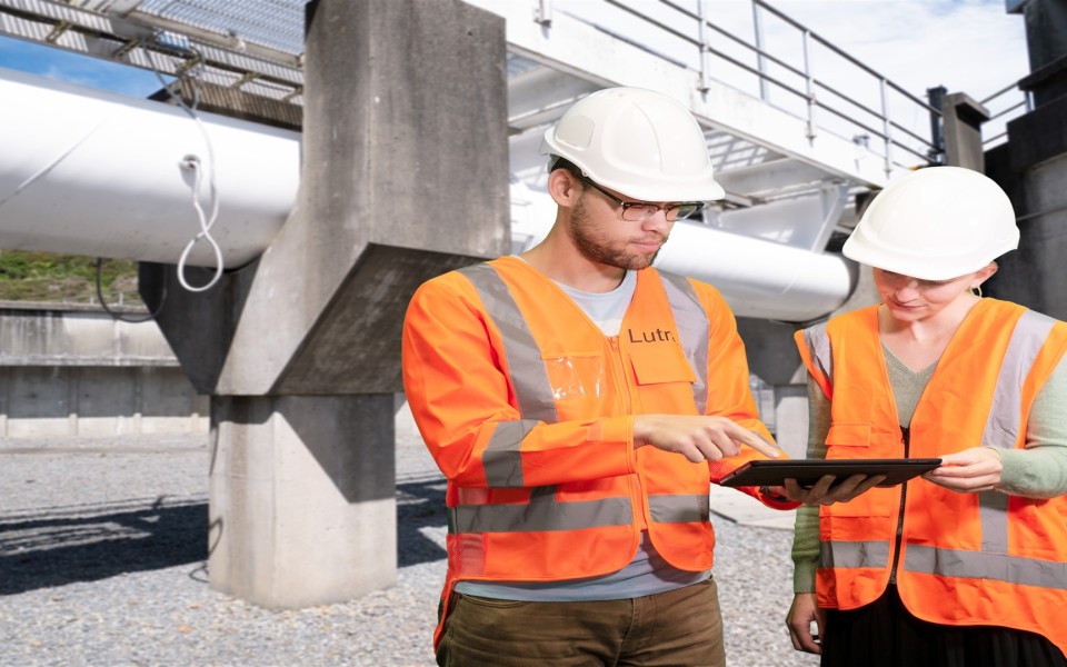 Process Engineer At Water Treatment Plant Checking Ipad